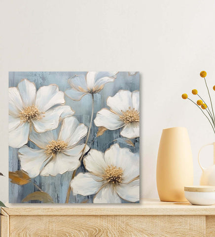 A Stunning Canvas Painting Featuring Delicate White Flowers on a Vibrant Blue Canvas